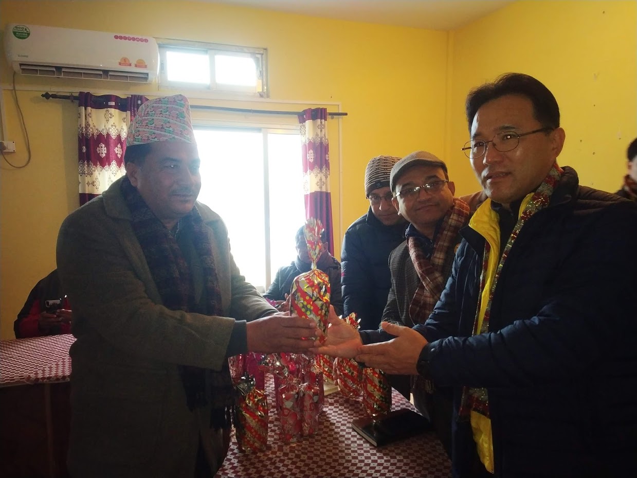 Registrar Dr Govind Singh Bista Delivering token of love to the Chinese guest.   